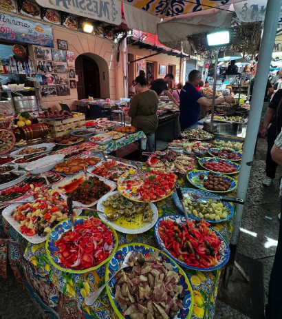 Sicilian market plates of caponata, olives and seafood on hand-painted maiolica