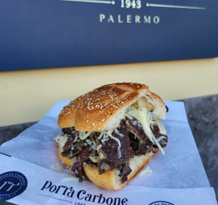 A Porta Carbone beef sandwich on a sesame roll in Palermo